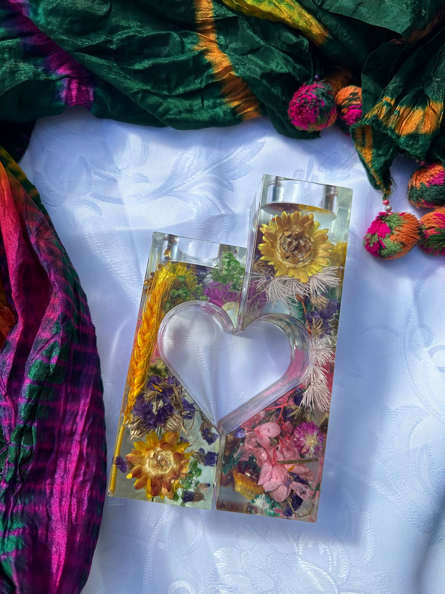 "Floral heart-shaped candle holder: A captivating centerpiece."