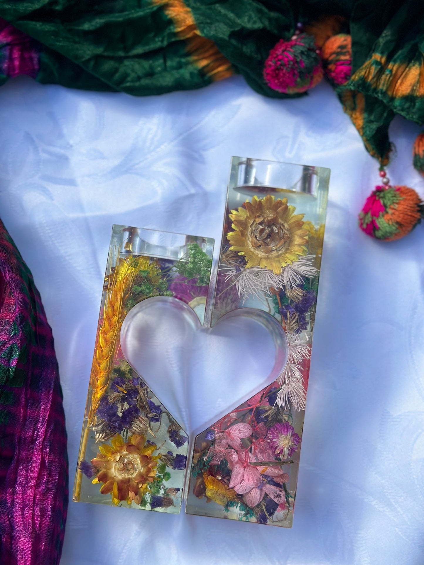 "Floral heart-shaped candle holder: A captivating centerpiece."