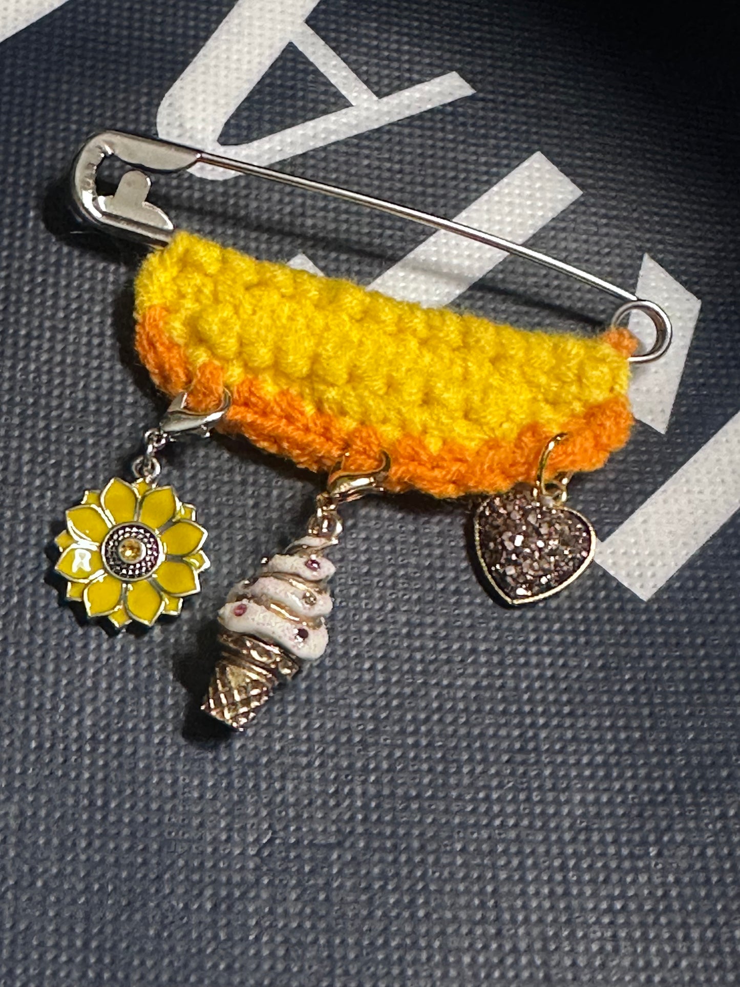Crocheted yellow and orange Safety Pin Brooch with  ICE CREAM & SUNFLOWER charms 
