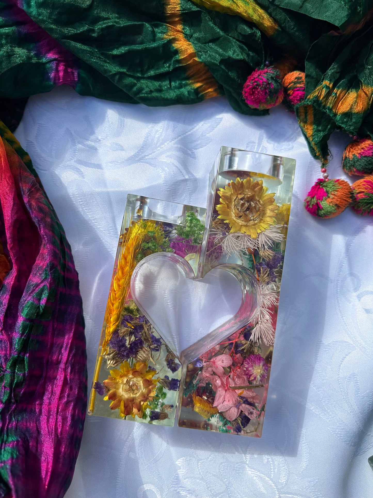 "Floral heart-shaped candle holder: A captivating centerpiece."